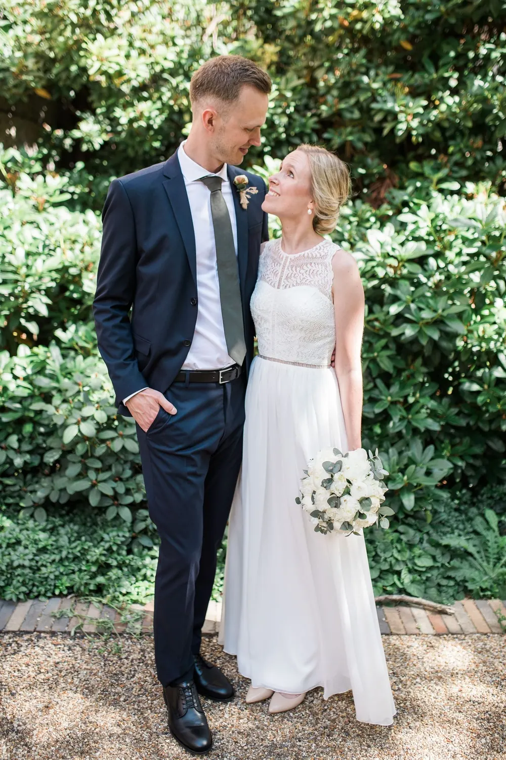 Bride and groom in a garden after the ceremony